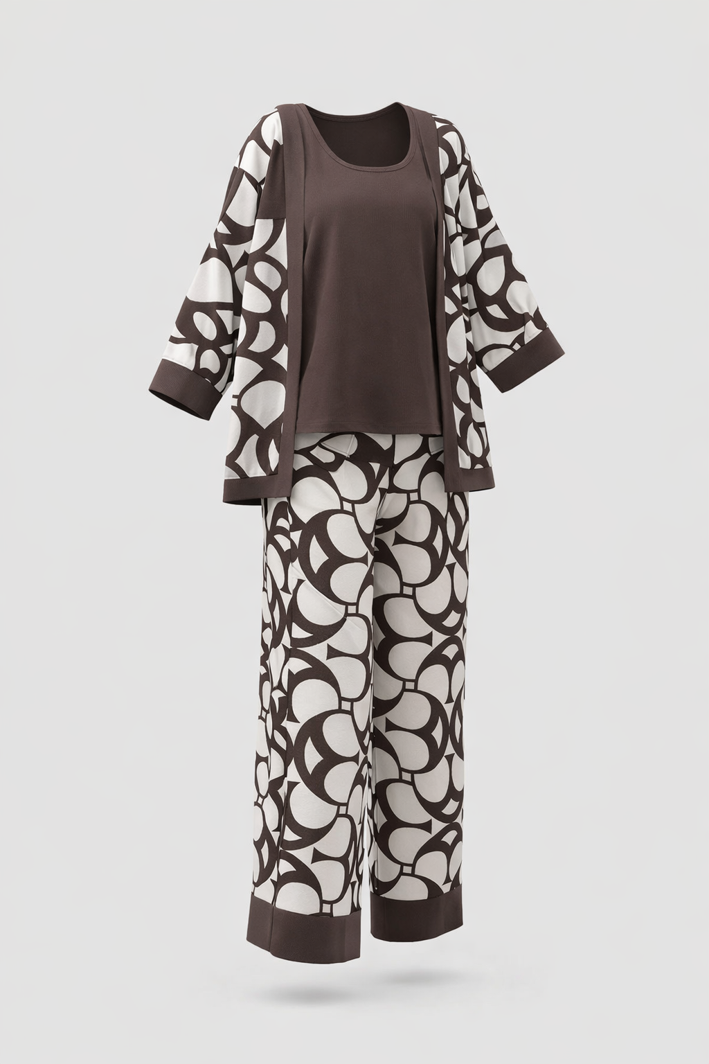 Brown top and pants with white abstract patterns on a light gray background
