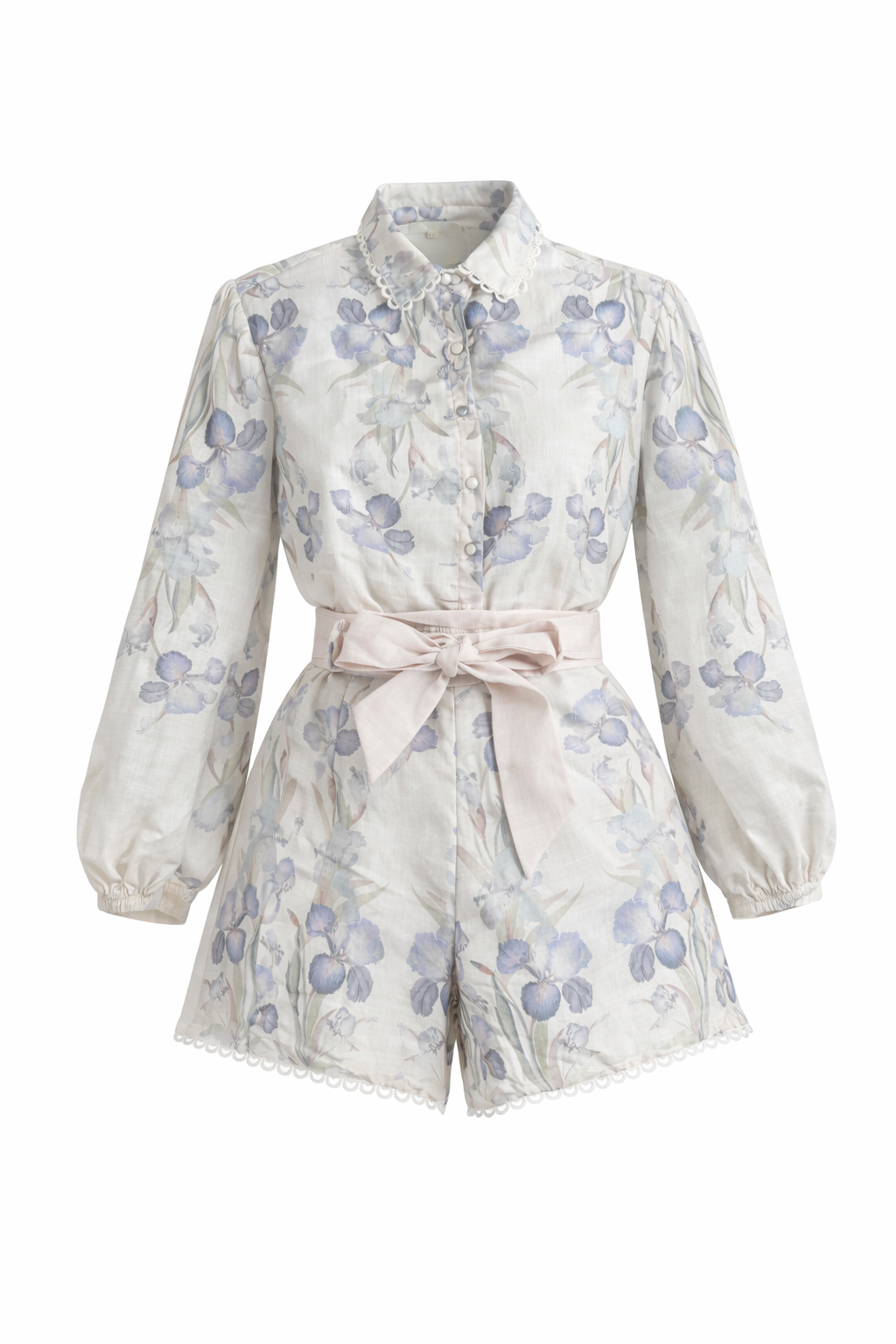 Floral-patterned romper with a bow tie on a white background
