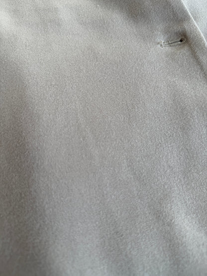 Close-up of gray fabric with a small button