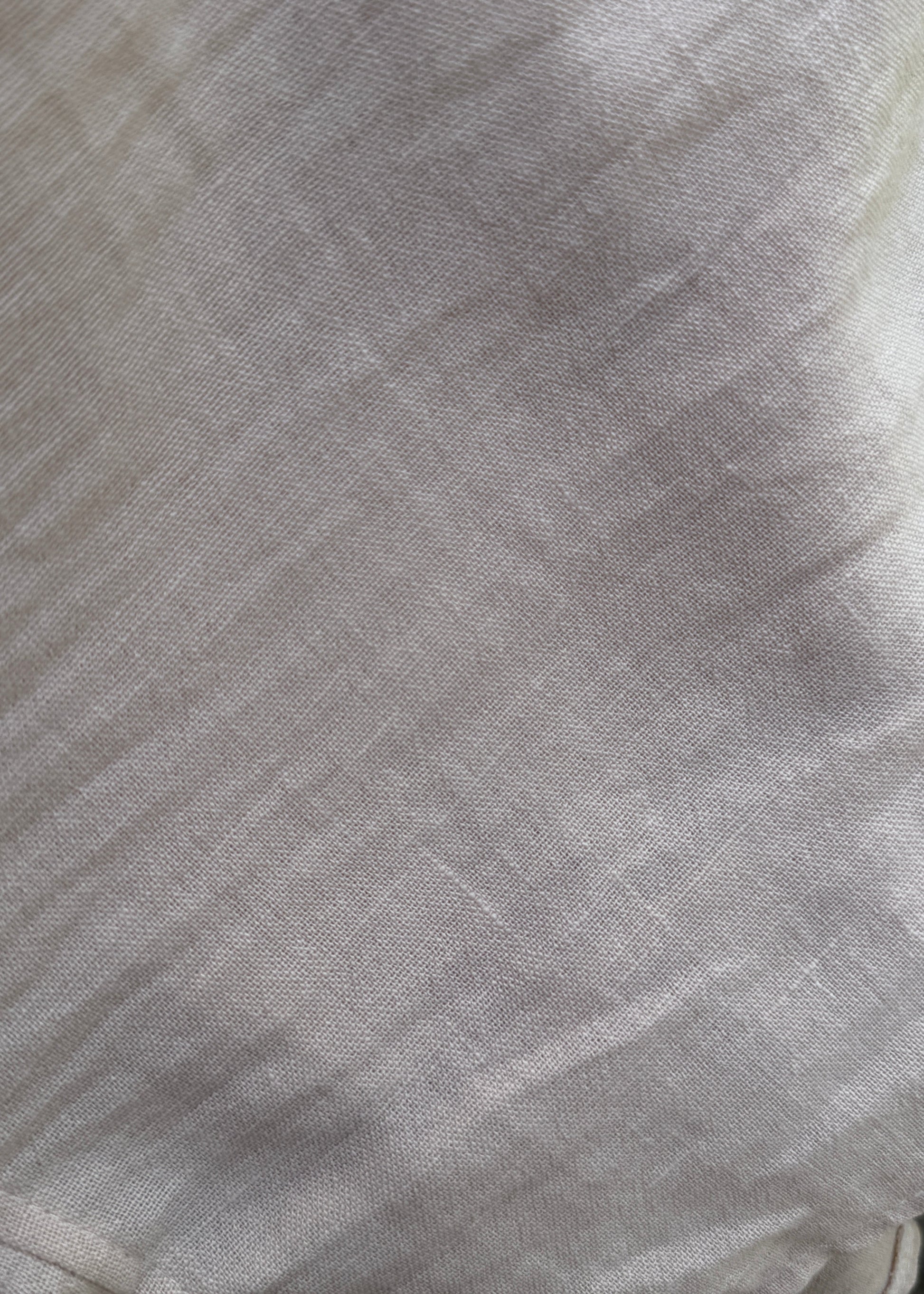 Close-up of gray fabric with a subtle pattern