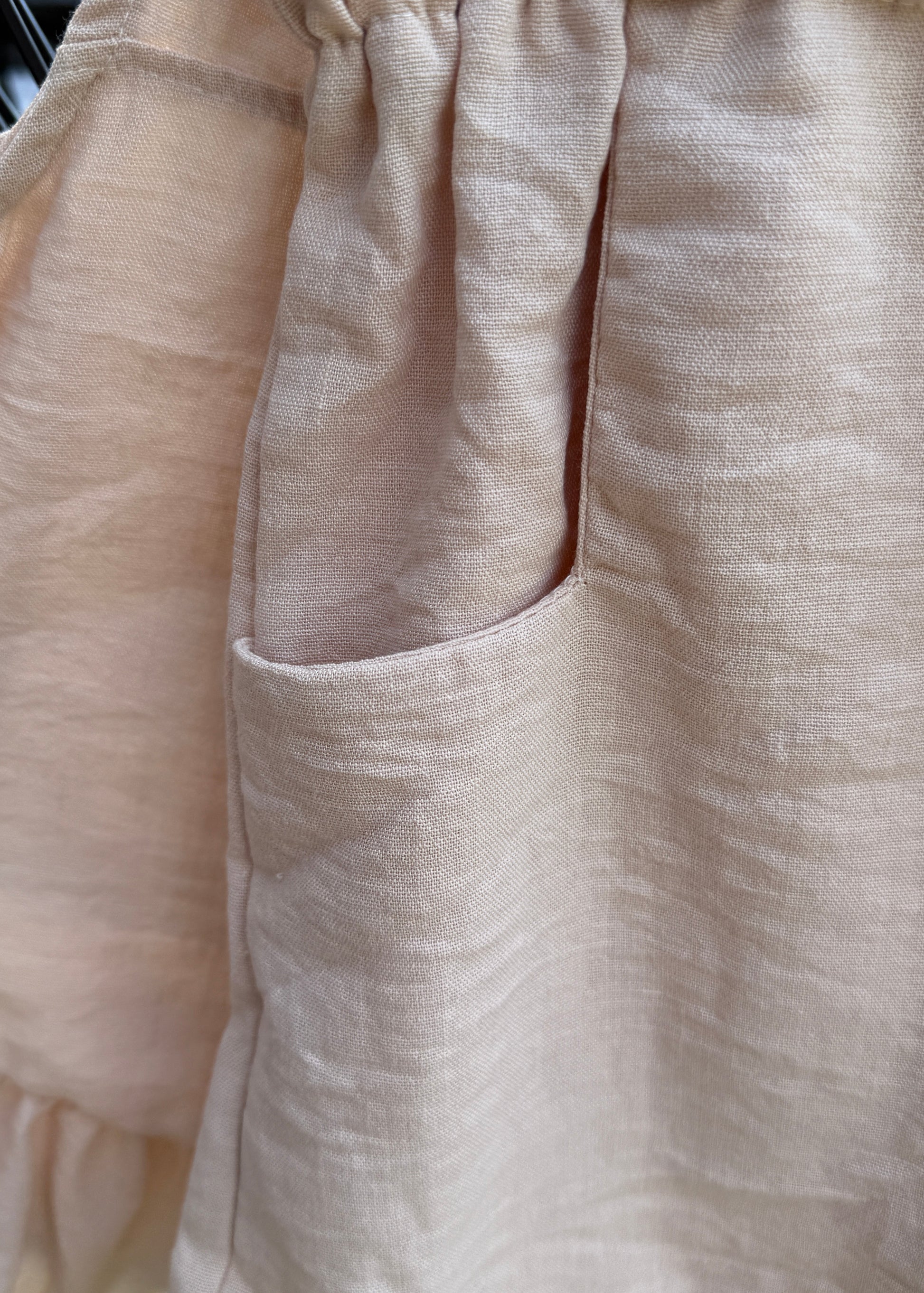 Close-up of beige fabric with a subtle pattern