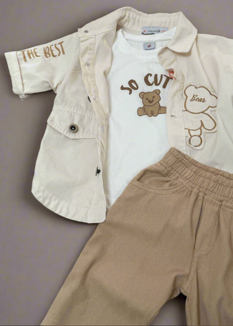 Children's outfit with beige jacket, white t-shirt with teddy bear design, and brown pants on a gray background.