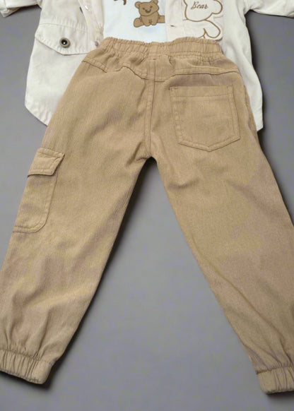 Beige cargo pants on a gray surface