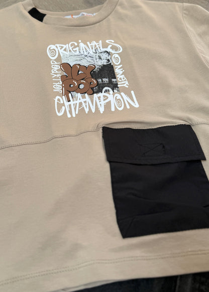 Beige sweatshirt with black pocket and graphic text design on a neutral background
