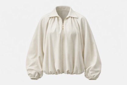 Kreminis bomberis baltam fone