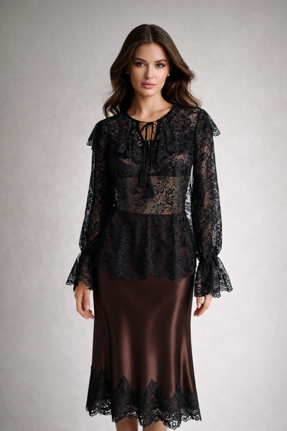 Woman wearing a black lace top and brown skirt on a gray background