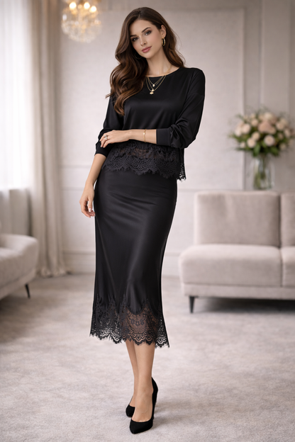 Woman wearing a black lace dress in a stylish room with furniture and decor.