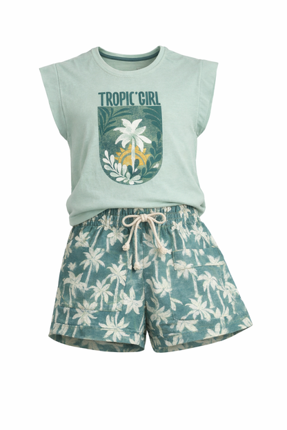 Light green sleeveless top with 'Tropic Girl' text and floral design, paired with floral shorts on a white background.
