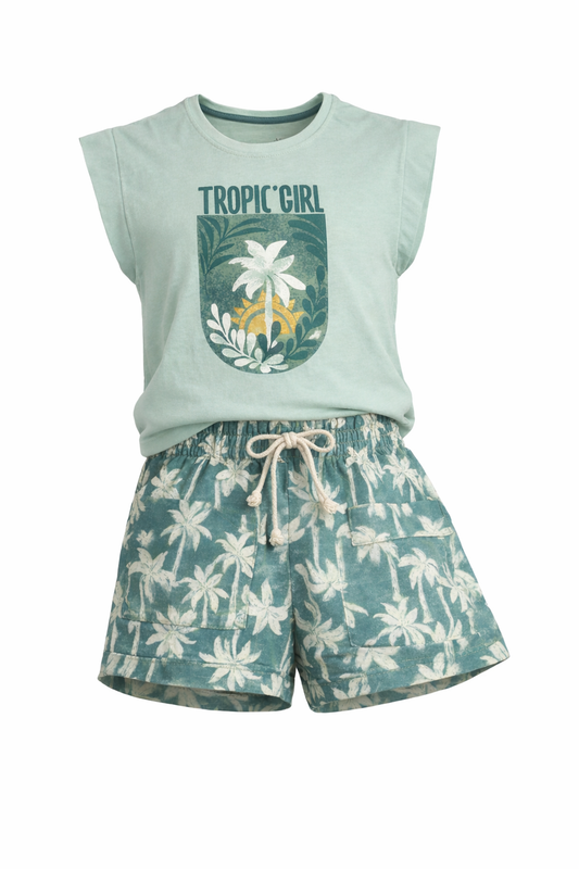Light green sleeveless top with 'Tropic Girl' text and floral design, paired with floral shorts on a white background.