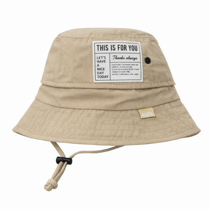 beige kepure su tinkleliu
