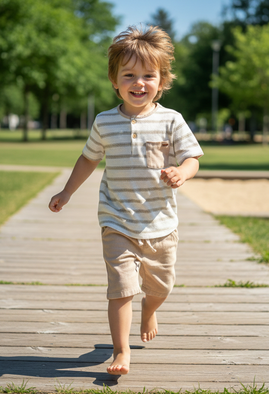 Child running on a wooden path in a park