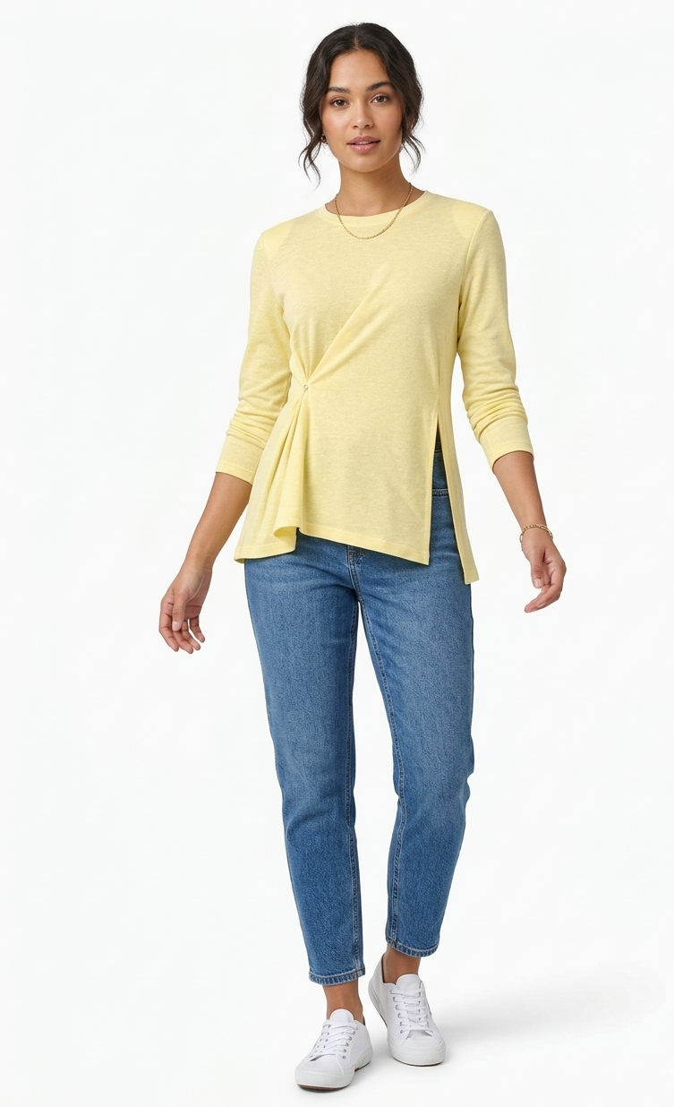 Woman wearing a yellow top and blue jeans on a white background
