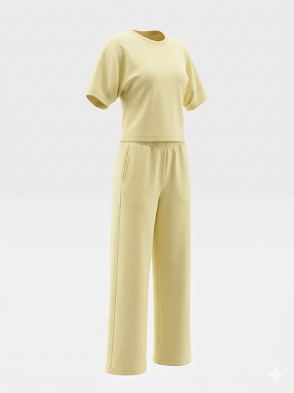 Yellow outfit with a top and pants on a white background