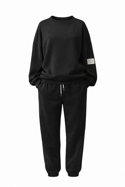 Black tracksuit with a brand logo on a white background