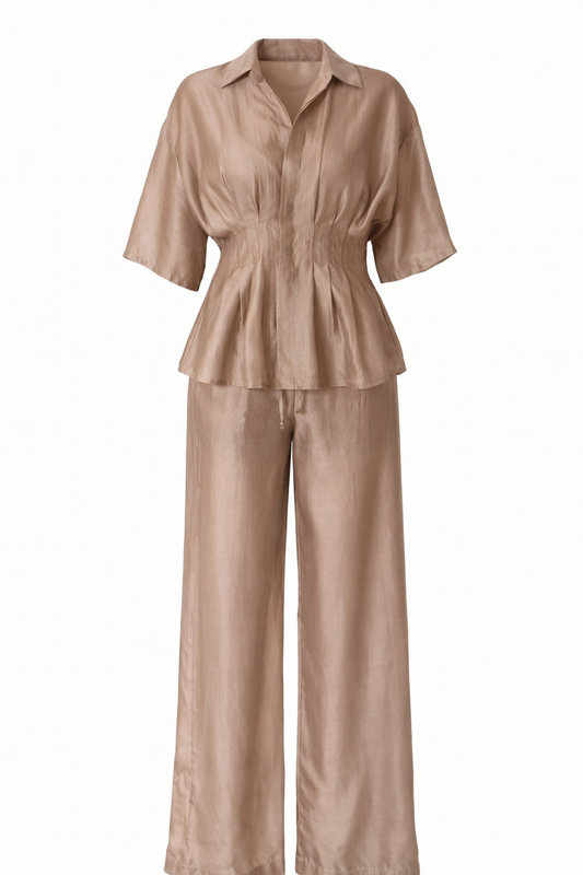 Beige shirt and pants set on a white background