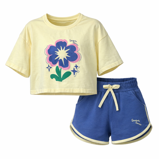 Children's outfit with yellow crop top and blue shorts on a white background
