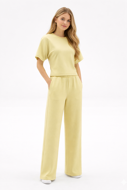 Woman wearing a yellow outfit on a white background