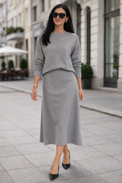 Woman wearing a gray outfit on a city street